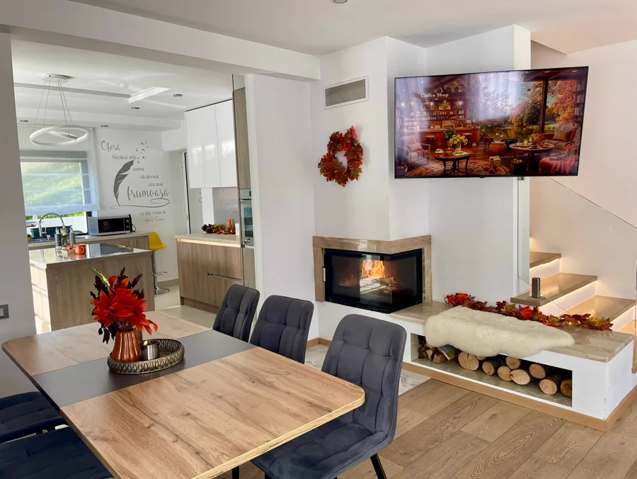 Living room decorated for autumn with fireplace and golden ornaments